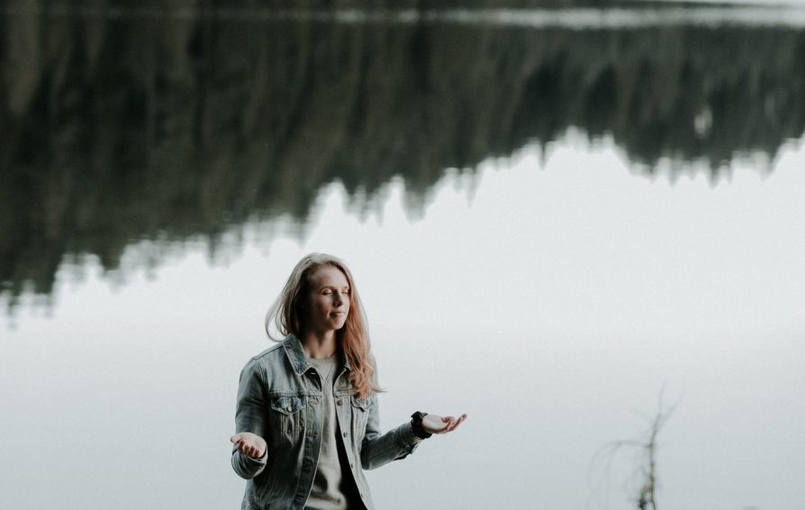woman relaxing in a peaceful looking environment