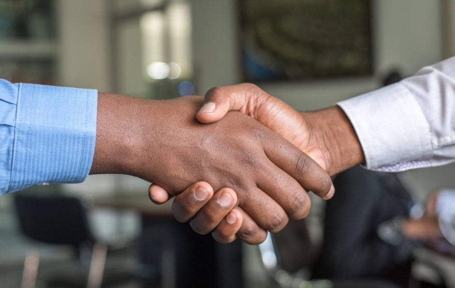 Shaking hands with client after project closure