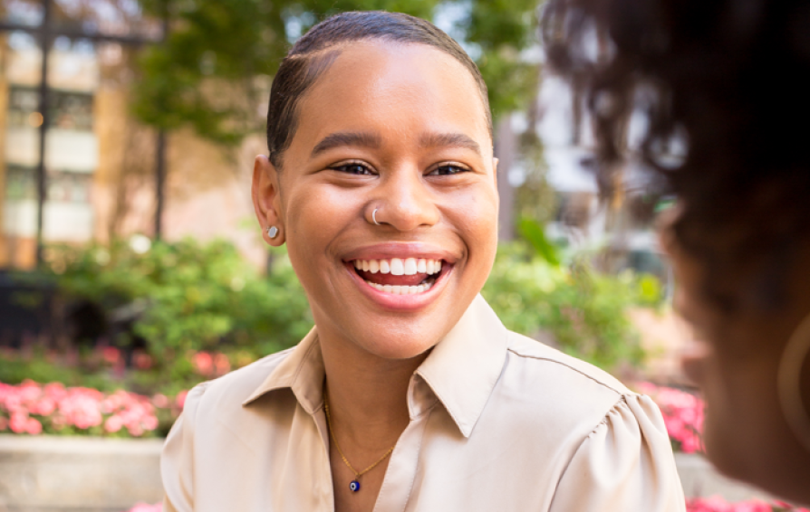 woman smiling in conversation