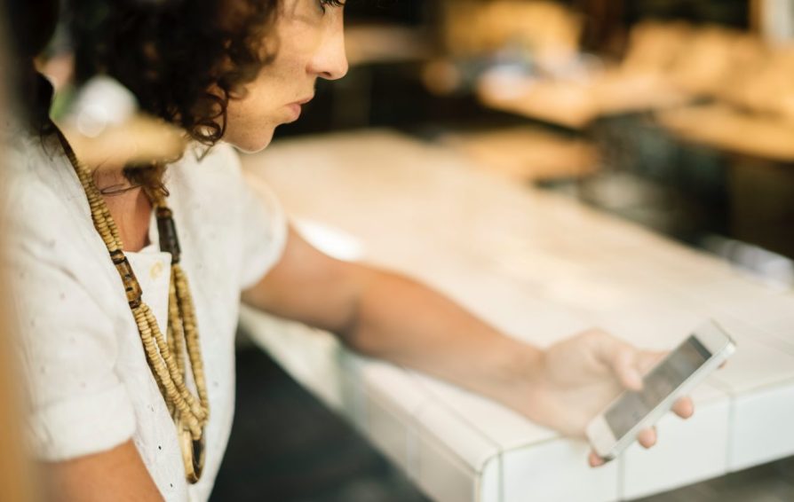 a woman on her laptop learning how to file self-employed taxes