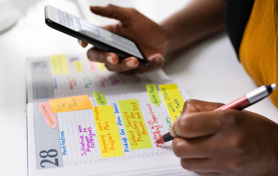 Person using scheduling throughout their clientflow with a calendar and an app