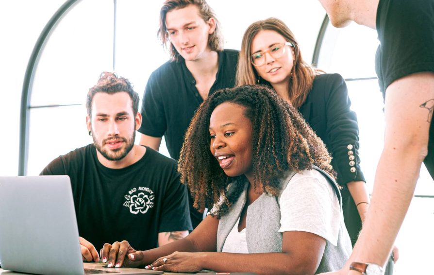 Group of people looking at computer