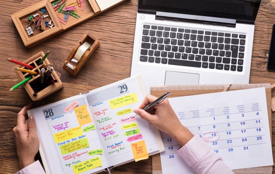Person using a shared calendar on paper