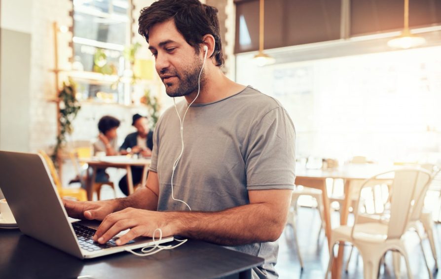 man on a laptop learning how to get more consulting clients fast