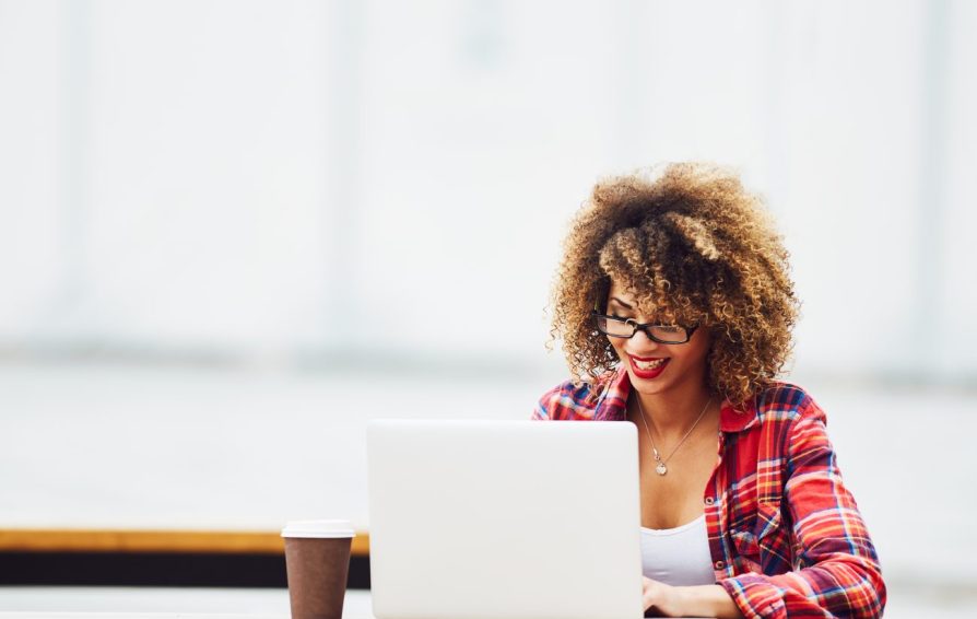 a woman on a laptop learning how to automate her business