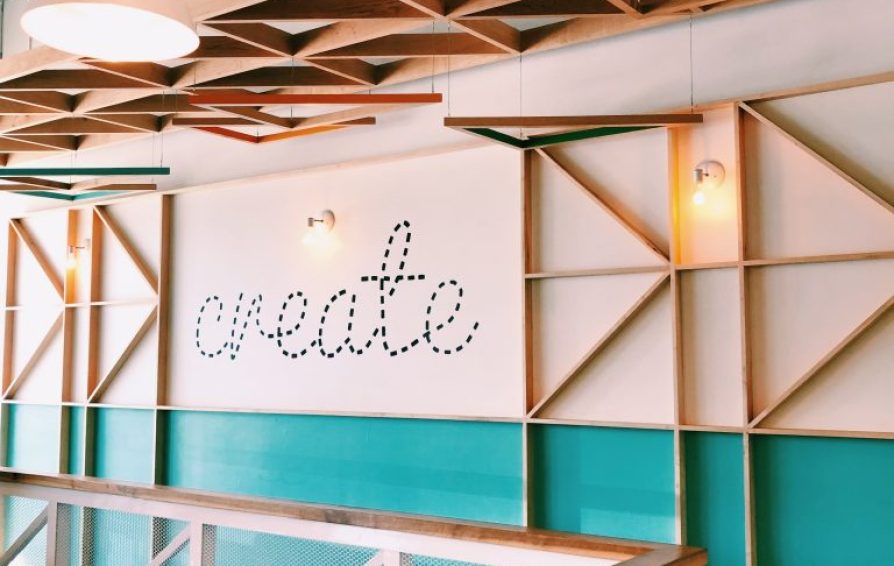 a modern interior space with wood accents and create painted on the wall