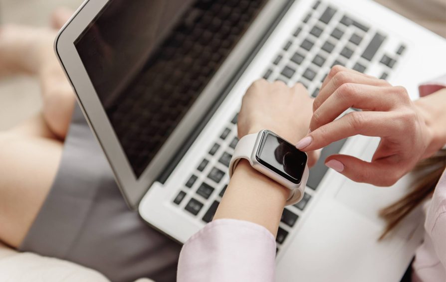 Person tracking time the time on their watch
