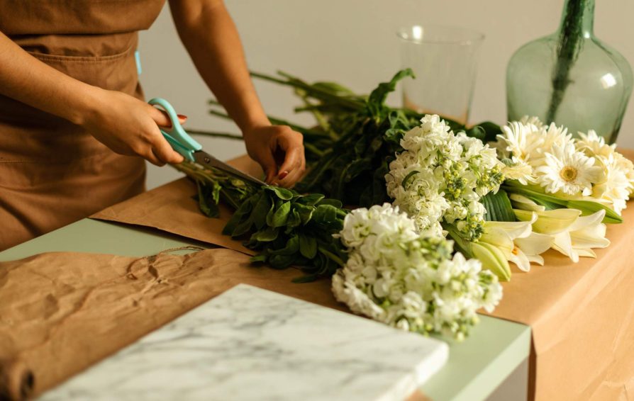 Wedding professional putting together a bouquet