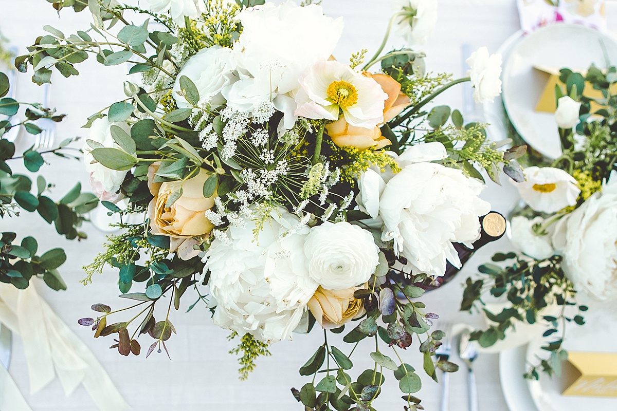 White and yellow floral arrangement for table centerpiece