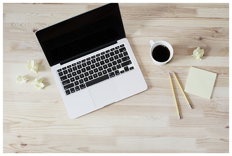 Flat lay of computer and coffee on a desk by Lauren Mancke on the Rising Tide Society & HoneyBook blog