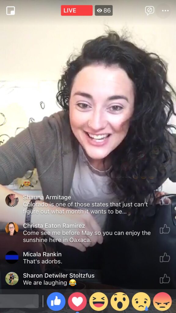 A woman leans into the camera in a screengrab of a Facebook livestream