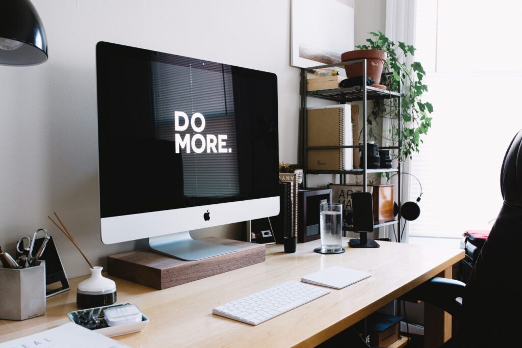 a desktop computer with the words do more on the screen