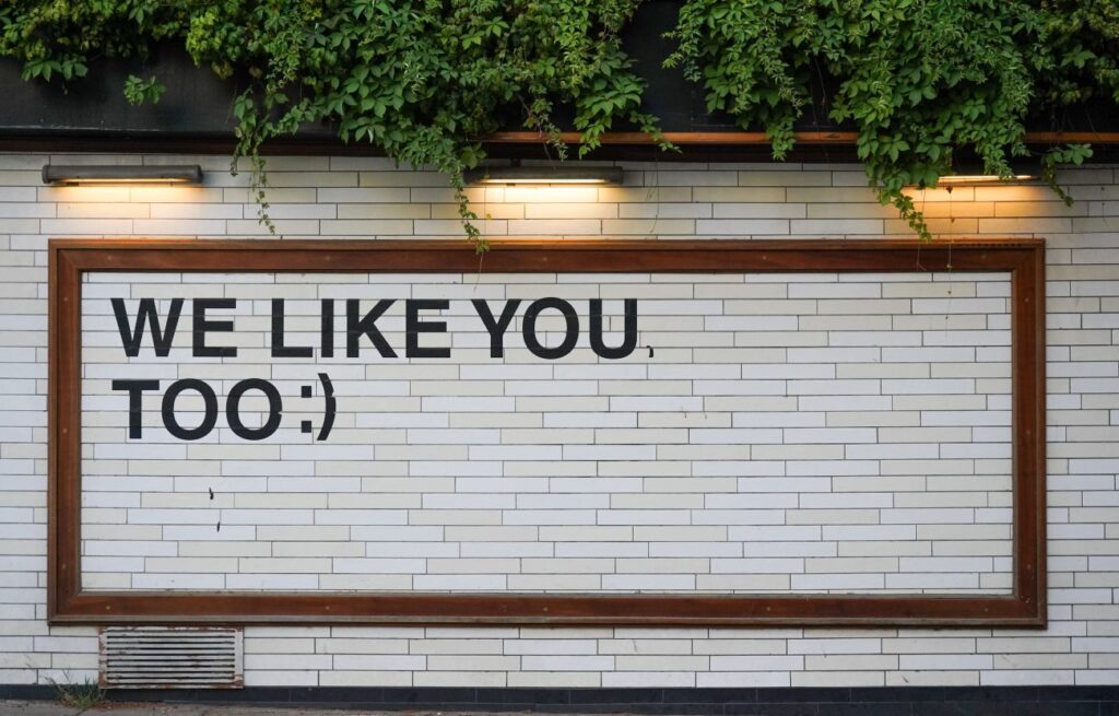 White brick wall with text on it that reads,