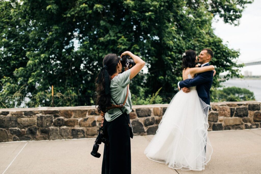 photographer taking pictures of a bride and groom