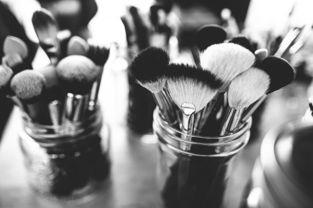 makeup brushes in glass jars