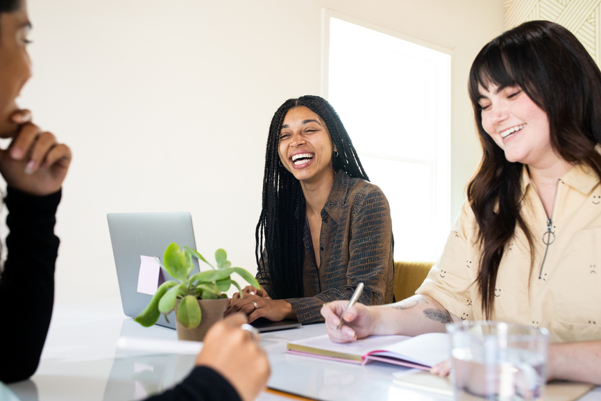 Female Entrepreneurs Laugh With Each Other
