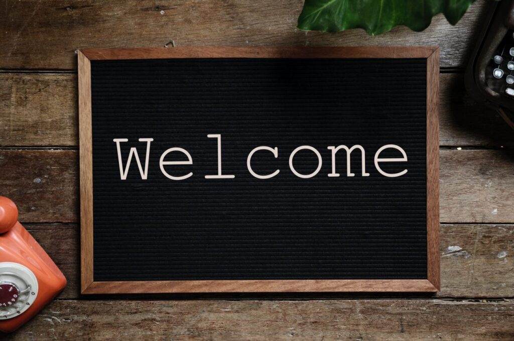 a desktop sign with letters that spell welcome