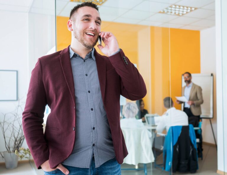 Man on the phone using his client management skills