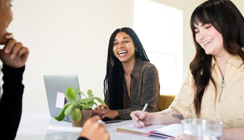 Female Entrepreneurs Laugh With Each Other