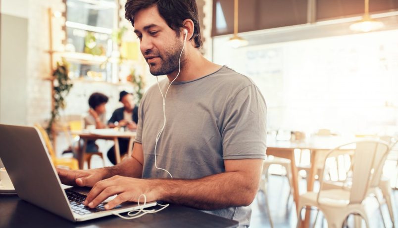 man on a laptop learning how to get more consulting clients fast